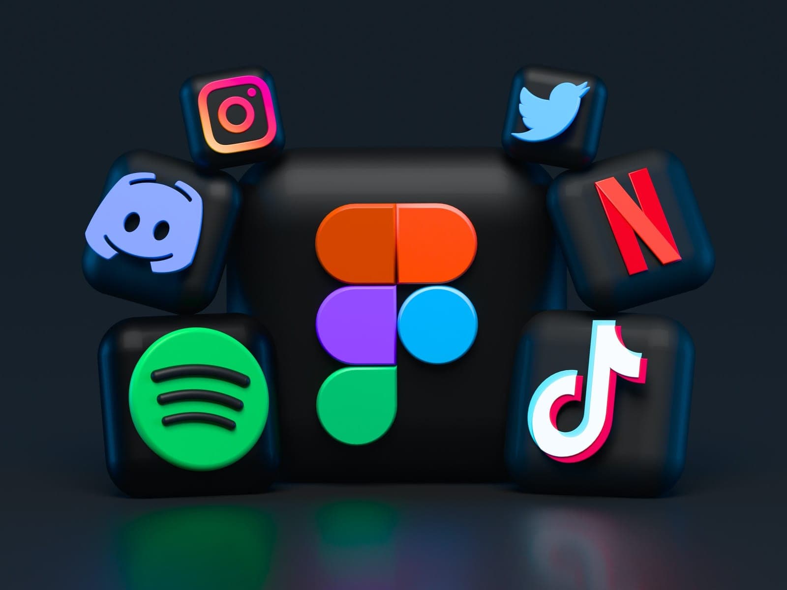 App icons for social networks and streaming services floating on a dark background