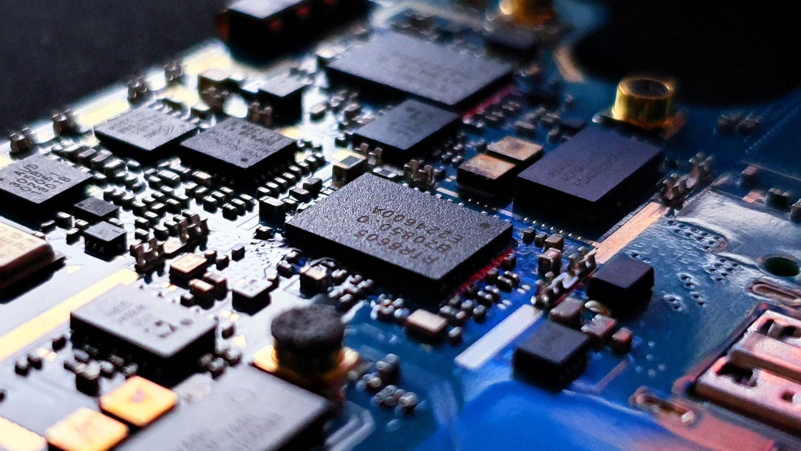 Close-up of chips on a blue circuit board