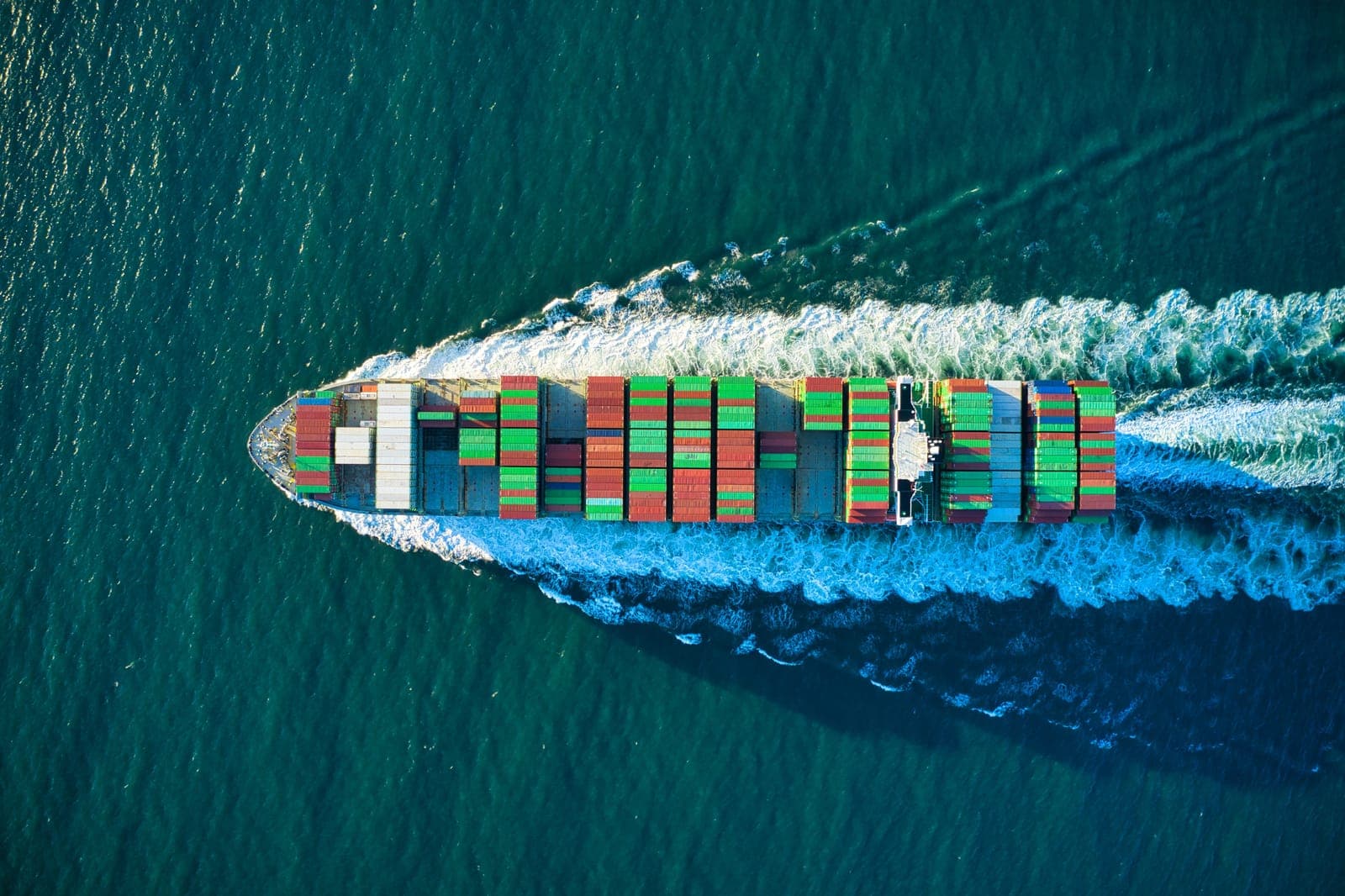 A container ship at sea seen from above